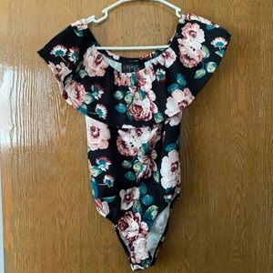 Form fitting off the shoulder bodysuit